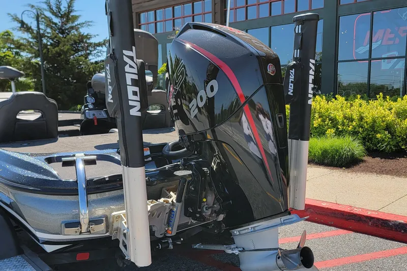 Slide: The Image of 2020 Nitro Z19 Pro boat with powerful engine and Talon anchors, parked outdoors. - 4