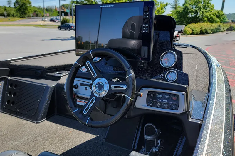 Slide: The Image of Dashboard of a 2020 Nitro Z19 Pro boat with steering wheel and electronic display. - 5