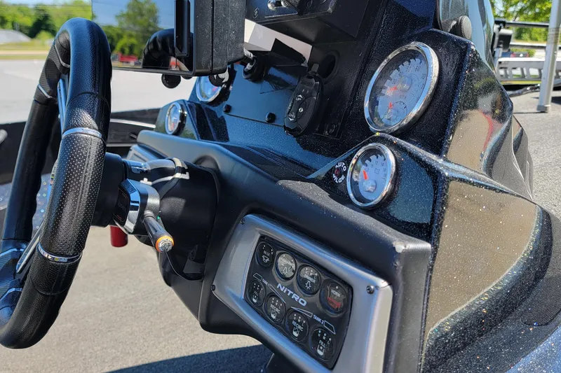 Slide: The Image of Dashboard of a 2020 Nitro Z19 Pro boat with steering wheel and gauges. - 7