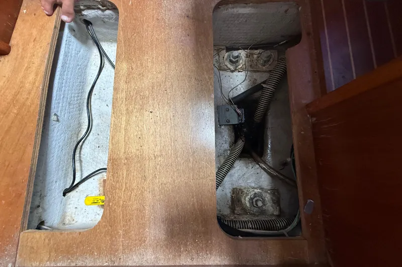 Slide: The Image of Interior view of a 2003 Jeanneau Sun Odyssey 37 sailboat showing wiring and compartments. - 106
