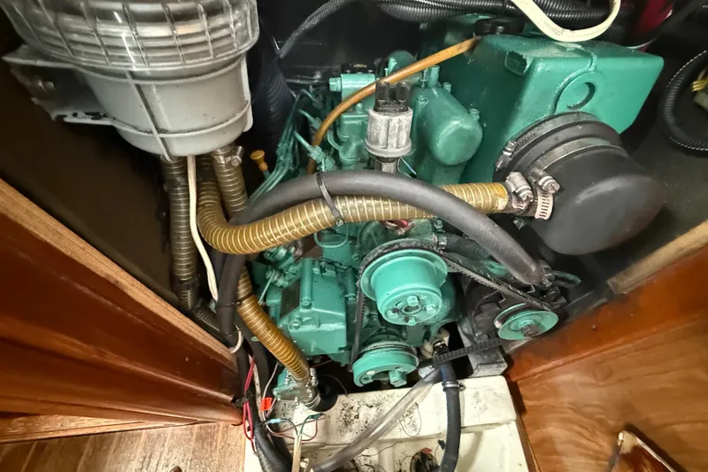 Slide: The Image of Engine compartment of a 2003 Jeanneau Sun Odyssey 37 sailboat, showcasing mechanical components. - 108