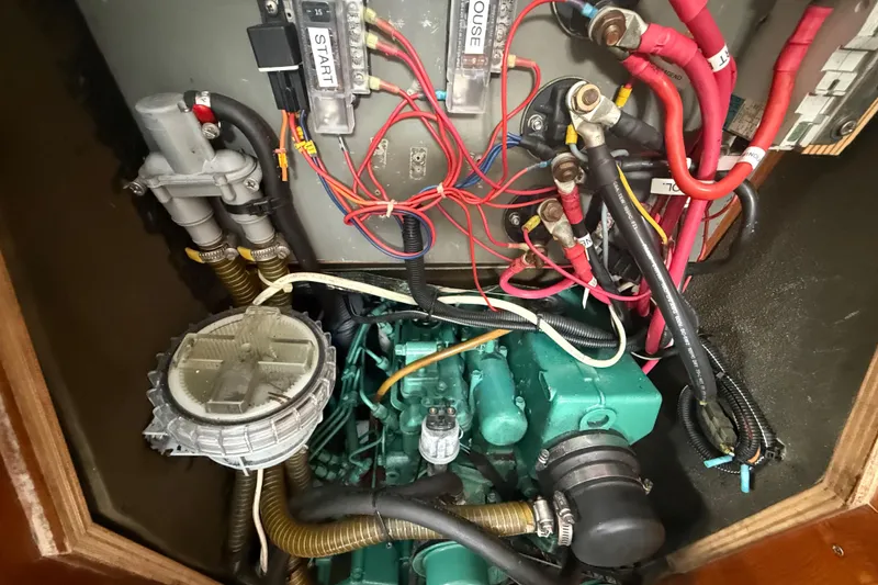 Slide: The Image of Engine compartment of a 2003 Jeanneau Sun Odyssey 37 sailboat, showing wiring and components. - 109
