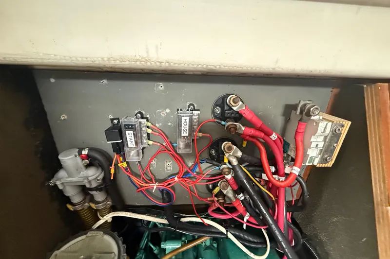 Slide: The Image of Electrical panel of a 2003 Jeanneau Sun Odyssey 37 sailboat, featuring wiring and components. - 110