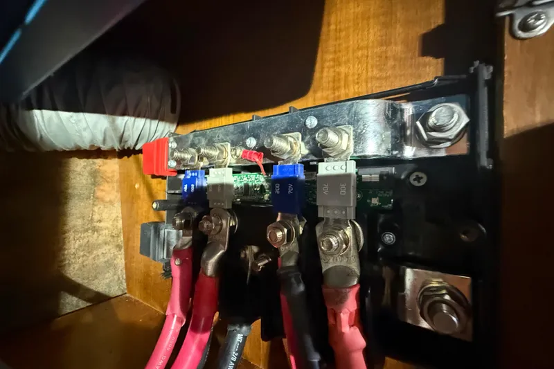 Slide: The Image of Electrical panel with fuses and wiring inside a 2003 Jeanneau Sun Odyssey 37 sailboat. - 111