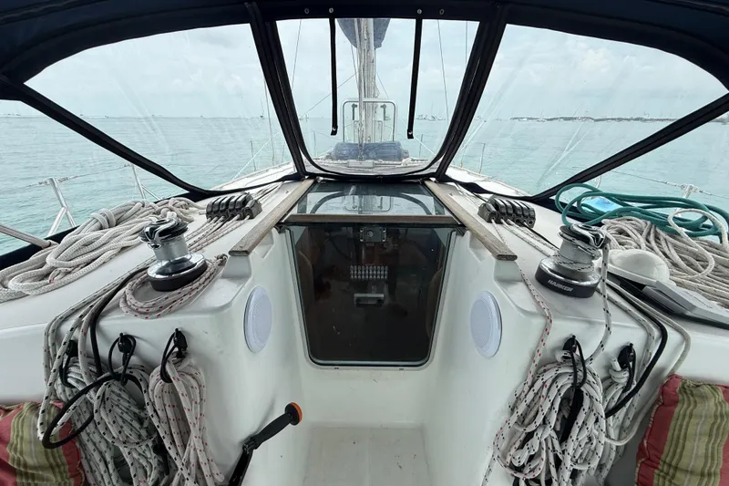 Slide: The Image of Cockpit view of 2003 Jeanneau Sun Odyssey 37 sailboat with ropes and winches. - 13