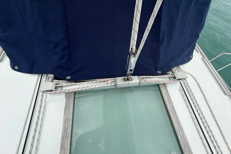 Slide: The Image of Deck view of 2003 Jeanneau Sun Odyssey 37 sailboat with rigging and blue cover. - 26