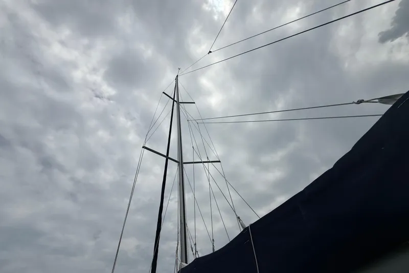 Slide: The Image of Mast of 2003 Jeanneau Sun Odyssey 37 sailboat against cloudy sky. - 28
