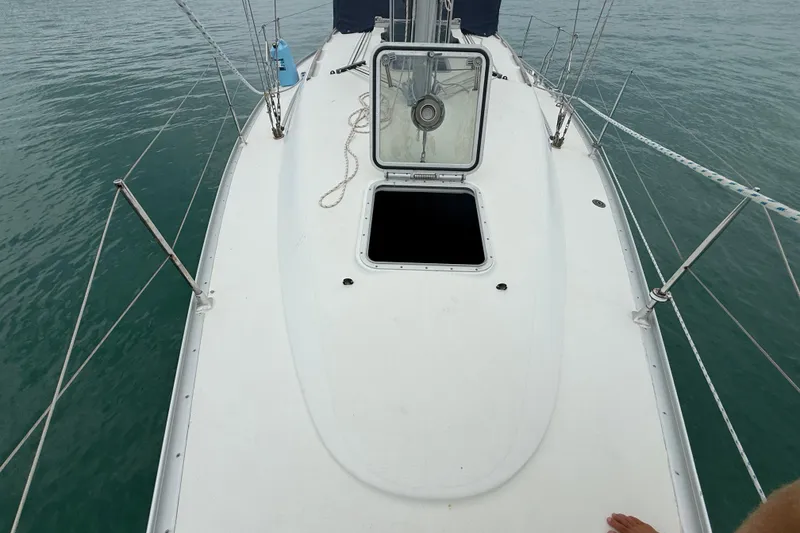 Slide: The Image of Deck view of a 2003 Jeanneau Sun Odyssey 37 sailboat with open hatch. - 36