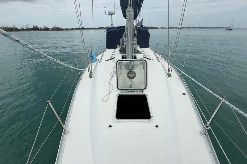 Slide: The Image of 2003 Jeanneau Sun Odyssey 37 sailboat deck view on calm waters. - 37