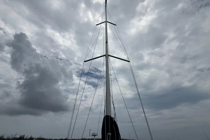 Slide: The Image of Mast of 2003 Jeanneau Sun Odyssey 37 sailboat against cloudy sky. - 39