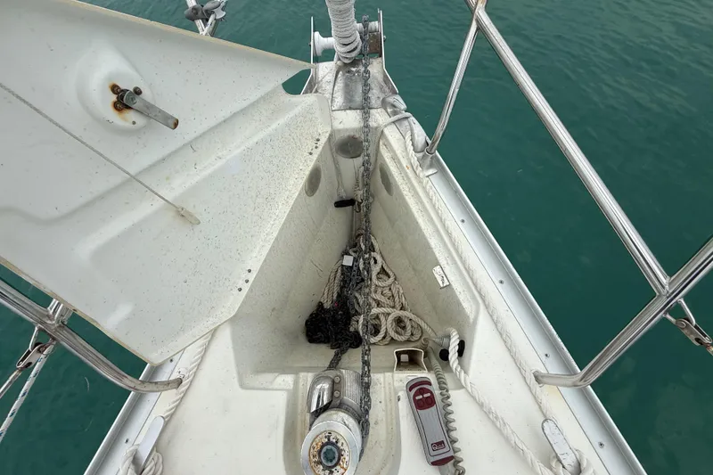 Slide: The Image of Anchor locker of 2003 Jeanneau Sun Odyssey 37 sailboat with chain and ropes. - 40