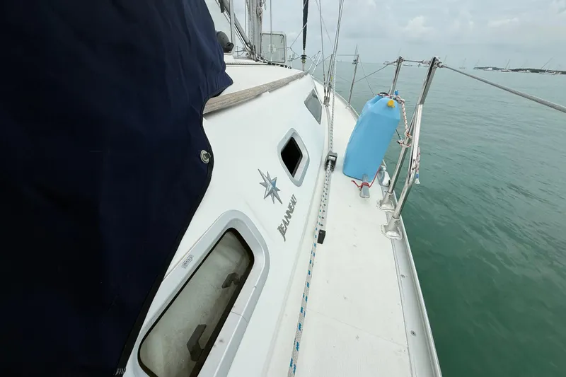 Slide: The Image of 2003 Jeanneau Sun Odyssey 37 sailboat deck with ocean view. - 45