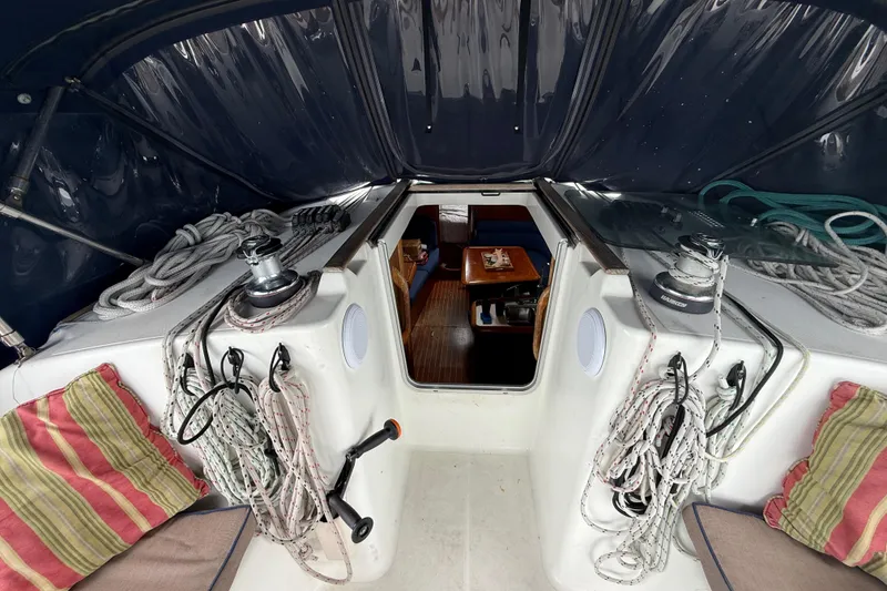 Slide: The Image of Cockpit view of 2003 Jeanneau Sun Odyssey 37 sailboat with ropes and cabin entrance. - 47