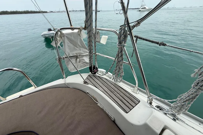 Slide: The Image of Jeanneau Sun Odyssey 37 sailboat deck, 2003 model, with ropes and ocean view. - 49