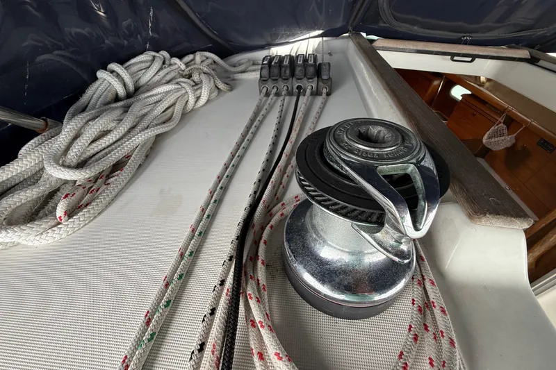 Slide: The Image of Deck of 2003 Jeanneau Sun Odyssey 37 with winch and ropes. - 52