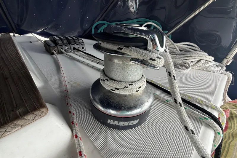 Slide: The Image of Winch and ropes on a 2003 Jeanneau Sun Odyssey 37 sailboat deck. - 55