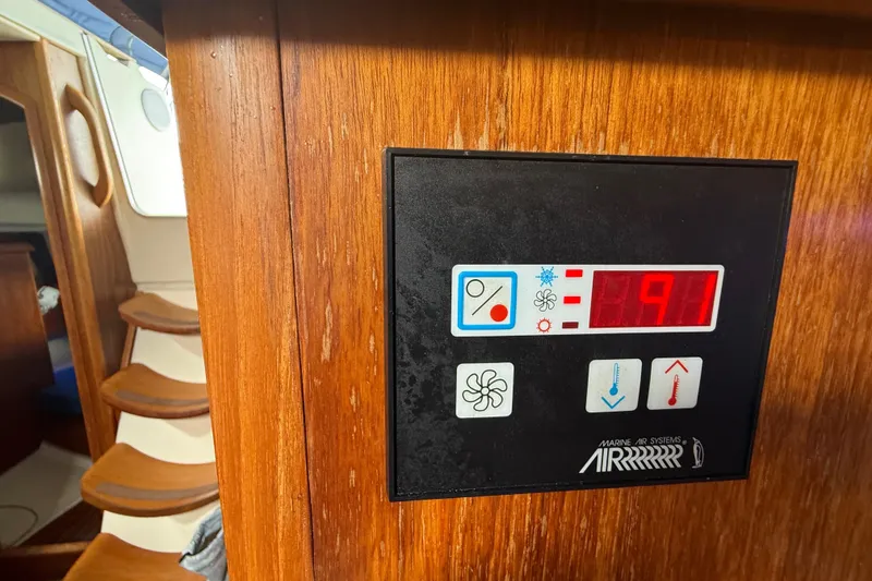 Slide: The Image of Control panel on 2003 Jeanneau Sun Odyssey 37 yacht, displaying temperature settings. - 60