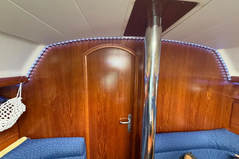Slide: The Image of Interior of 2003 Jeanneau Sun Odyssey 37 sailboat with wood paneling and LED lighting. - 64