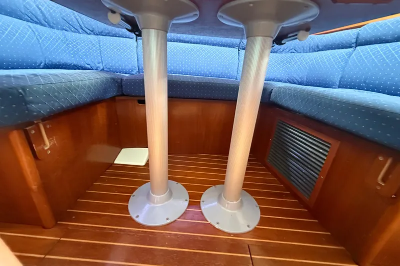 Slide: The Image of Interior of 2003 Jeanneau Sun Odyssey 37 sailboat with blue cushioned seating. - 72