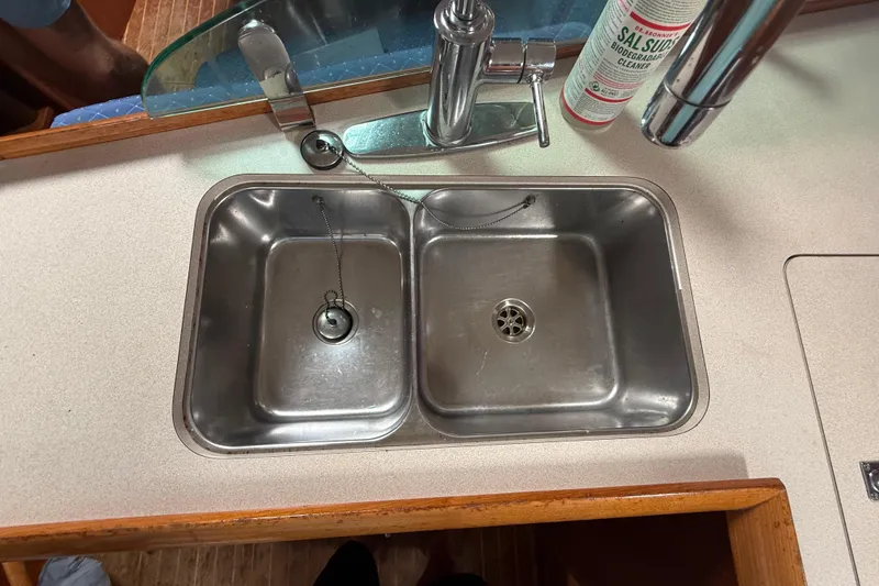 Slide: The Image of Stainless steel double sink in 2003 Jeanneau Sun Odyssey 37 yacht kitchen. - 76