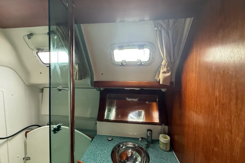 Slide: The Image of Interior of 2003 Jeanneau Sun Odyssey 37 yacht bathroom with sink and porthole. - 88