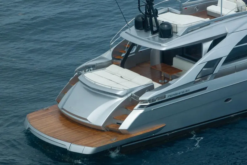 Slide: The Image of Luxury 2020 Pershing 8X yacht with sleek design and spacious deck on calm water. - 11