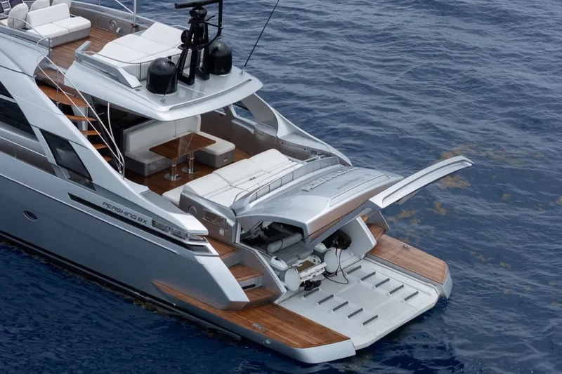 Slide: The Image of Luxury 2020 Pershing 8X yacht with sleek design and spacious deck on open water. - 12