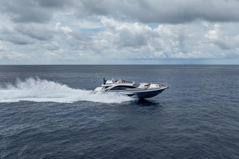 Slide: The Image of Luxury Pershing 8X yacht cruising on open sea under cloudy sky, 2020 model. - 15