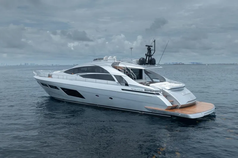 Slide: The Image of 2020 Pershing 8X yacht on calm ocean waters under cloudy skies. - 2