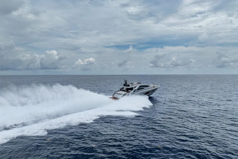 Slide: The Image of 2020 Pershing 8X yacht speeding across open ocean under cloudy sky. - 22
