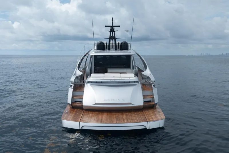 Slide: The Image of Luxury Pershing 8X yacht, 2020 model, on calm ocean waters under cloudy skies. - 3