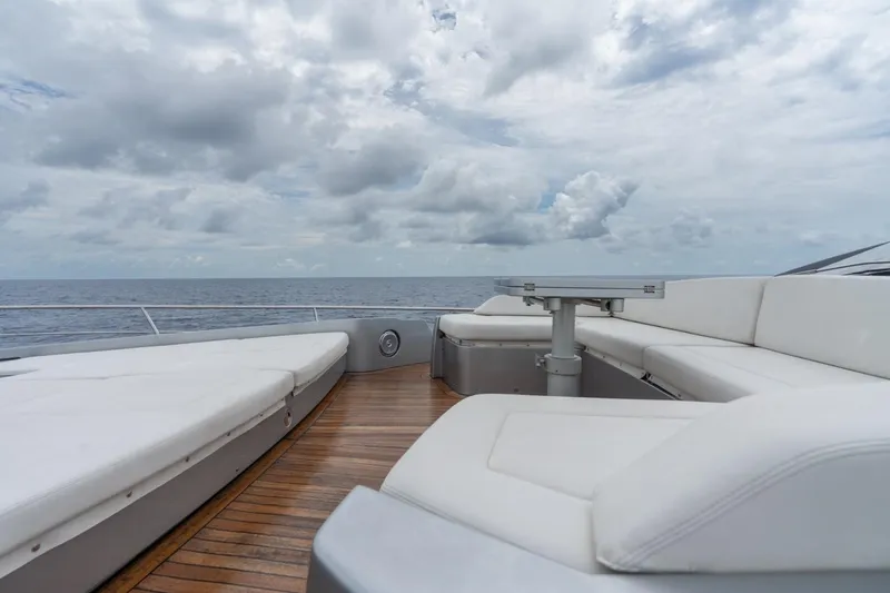 Slide: The Image of Luxurious deck of 2020 Pershing 8X yacht with ocean view and white seating. - 31
