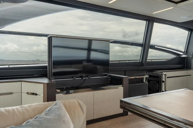 Slide: The Image of Luxurious interior of 2020 Pershing 8X yacht with modern TV and panoramic windows. - 43