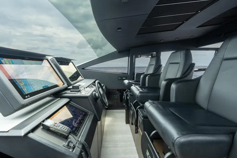 Slide: The Image of Luxurious 2020 Pershing 8X yacht cockpit with advanced navigation systems and plush seating. - 47