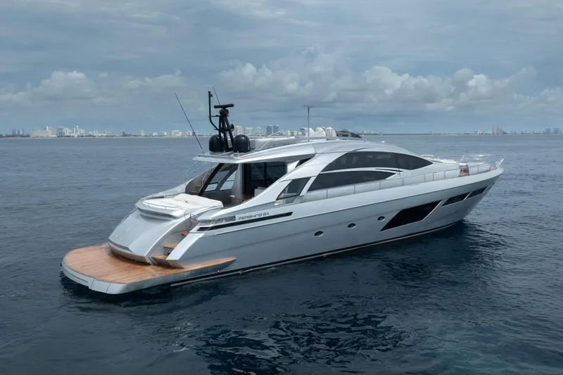 Slide: The Image of Luxury 2020 Pershing 8X yacht cruising on open water under cloudy skies. - 5
