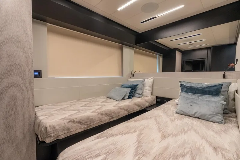Slide: The Image of Luxurious interior of 2020 Pershing 8X yacht with twin beds and modern decor. - 50