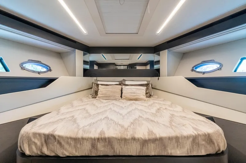 Slide: The Image of Luxurious bedroom interior of 2020 Pershing 8X yacht with modern design and elegant bedding. - 53