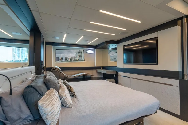 Slide: The Image of Luxurious bedroom interior of 2020 Pershing 8X yacht with modern design and large windows. - 57