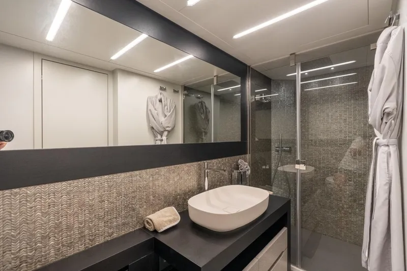 Slide: The Image of Luxurious bathroom in 2020 Pershing 8X yacht with modern fixtures and elegant design. - 58