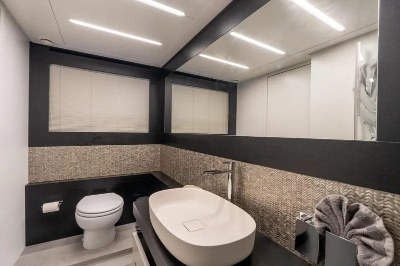 Slide: The Image of Modern bathroom interior on 2020 Pershing 8X yacht, featuring sleek sink and elegant design. - 59