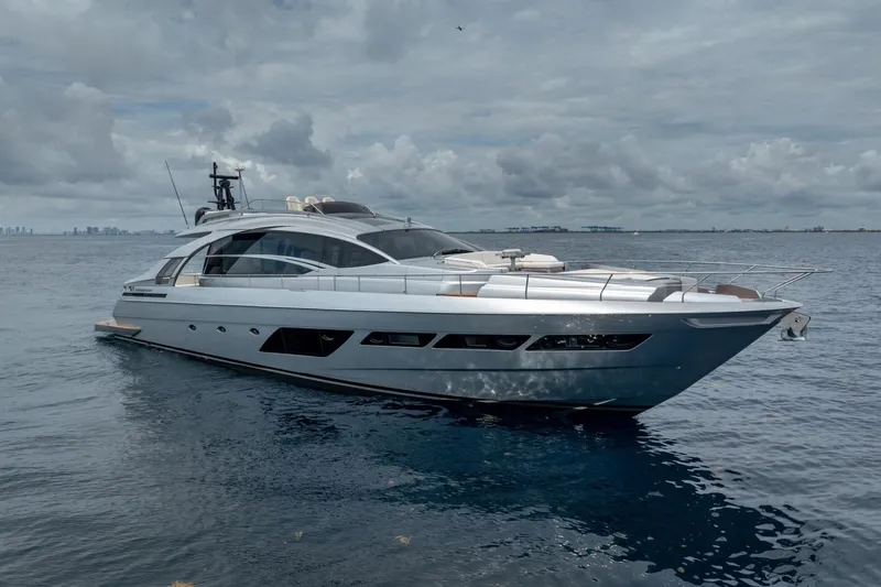 Slide: The Image of Luxury 2020 Pershing 8X yacht cruising on open water under cloudy skies. - 6