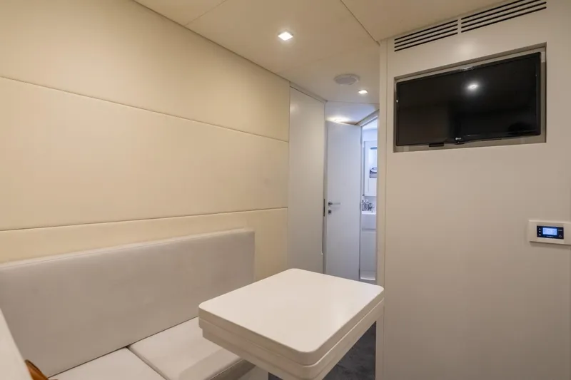 Slide: The Image of Interior of 2020 Pershing 8X yacht with modern seating and wall-mounted TV. - 61