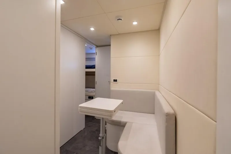 Slide: The Image of Interior of 2020 Pershing 8X yacht with modern seating and table. - 66