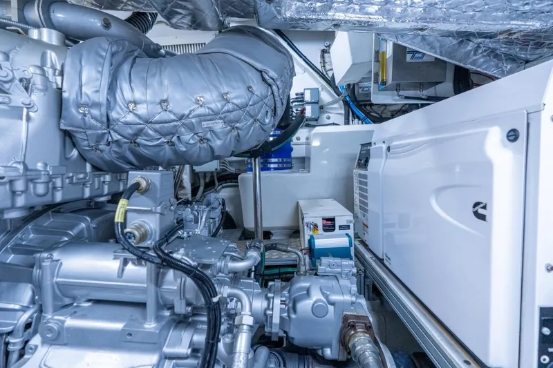 Slide: The Image of Engine room of a 2020 Pershing 8X yacht, showcasing advanced machinery and components. - 71