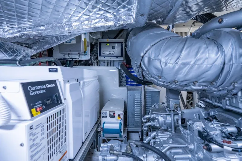 Slide: The Image of Engine room of 2020 Pershing 8X yacht featuring Cummins Onan generator. - 72