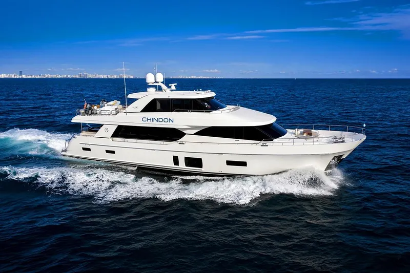 The Image of 2017 Ocean Alexander 100 Motoryacht cruising on open sea under clear blue sky. - 0