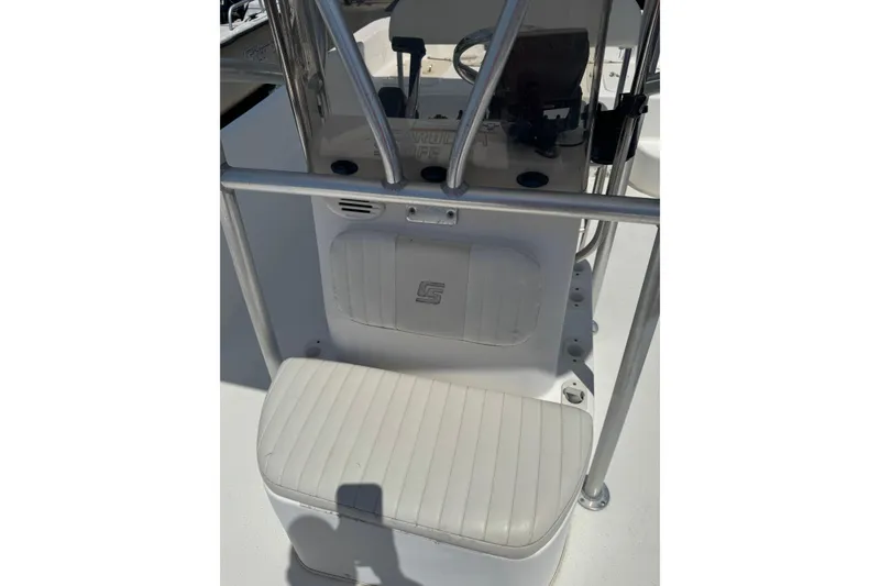Slide: The Image of 2010 Carolina Skiff 198 DLV boat console with seating and steering wheel. - 11