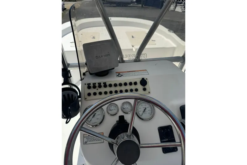 Slide: The Image of 2010 Carolina Skiff 198 DLV boat dashboard with Garmin GPS and control panel. - 12