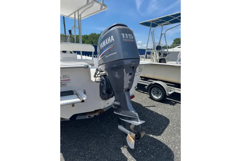 Slide: The Image of 2010 Carolina Skiff 198 DLV with Yamaha 115 outboard motor, parked on trailer. - 5