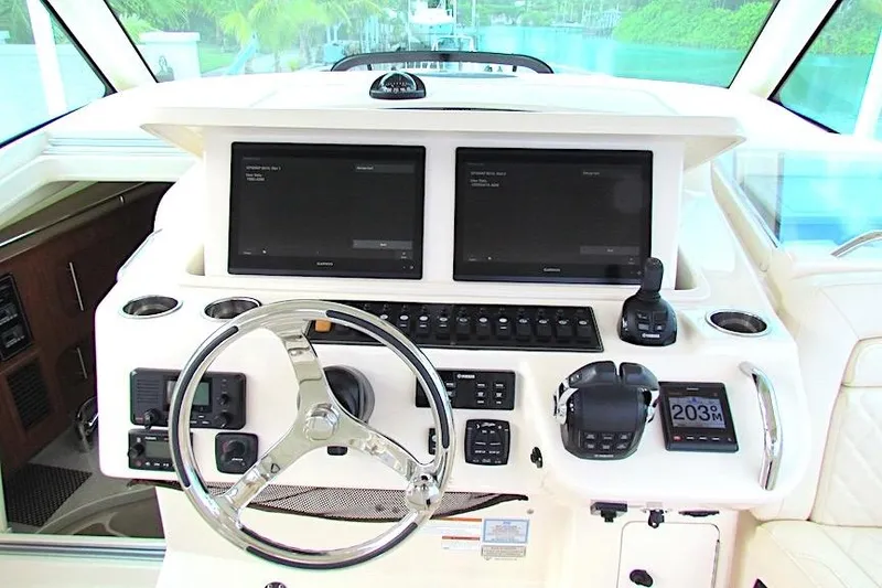 Slide: The Image of 2019 Grady-White Express 370 helm with dual screens and modern controls. - 11